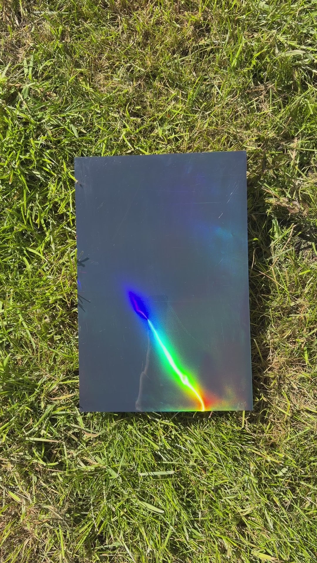 A video clip showing our Cosmic Black iridescent vinyl used to wrap the mobility cane.